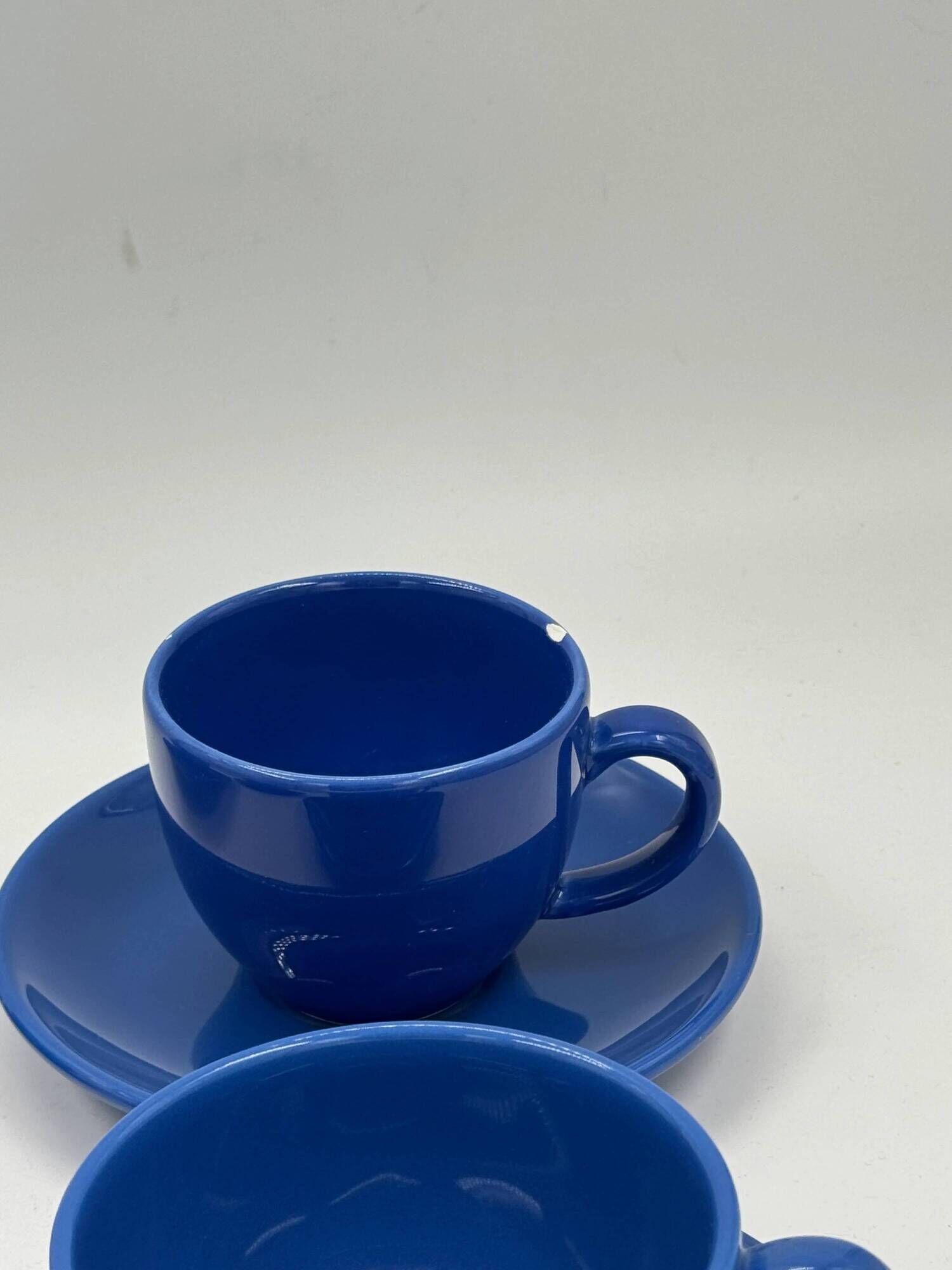 Set of 4 vintage blue ceramic cups and saucers.
