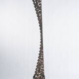 Indonesian construction element in carved wood with intertwined plant motifs mounted on a base (fri