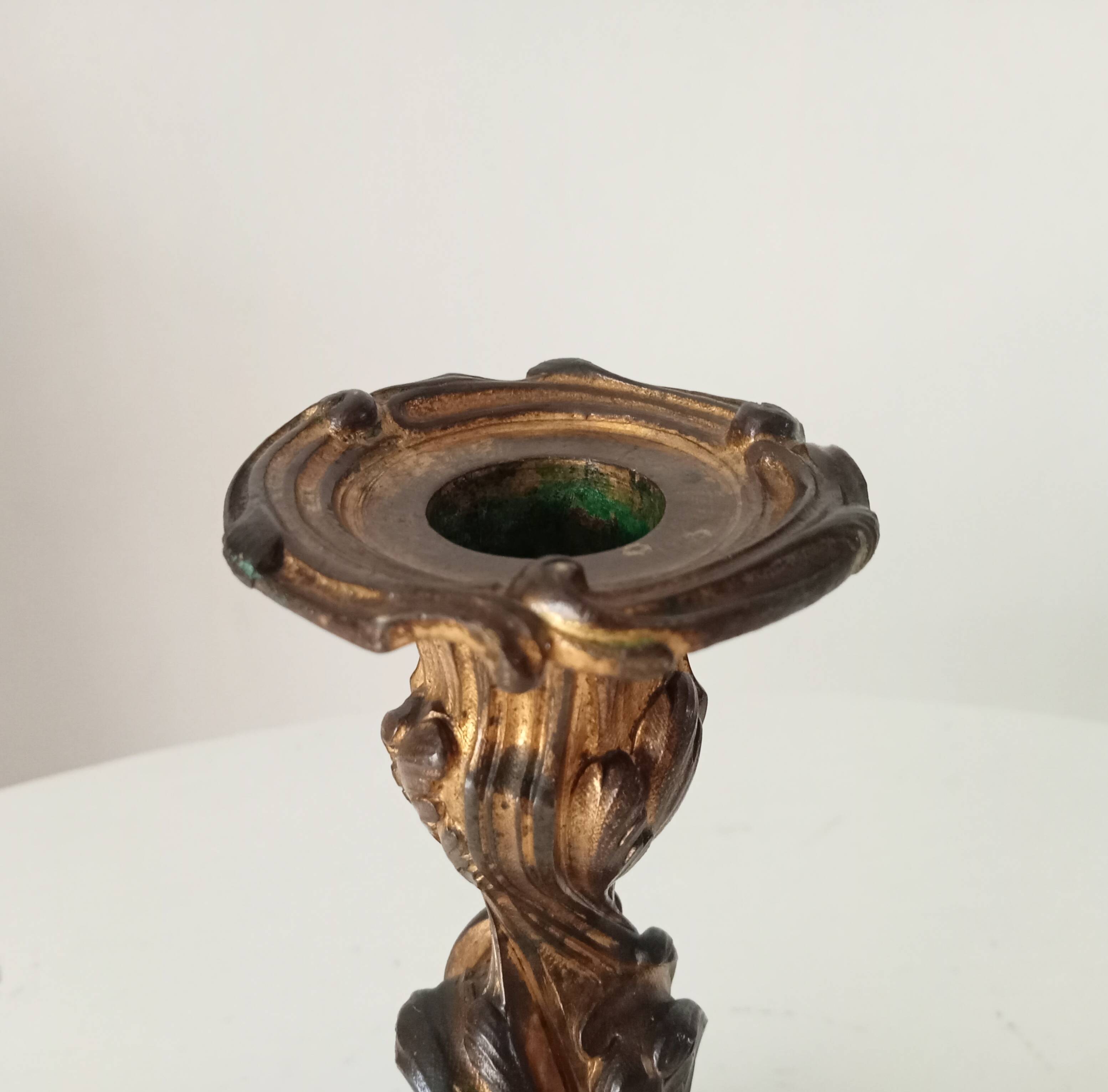 Antique 19th-century solid gilded bronze candlestick in the Louis XV style.