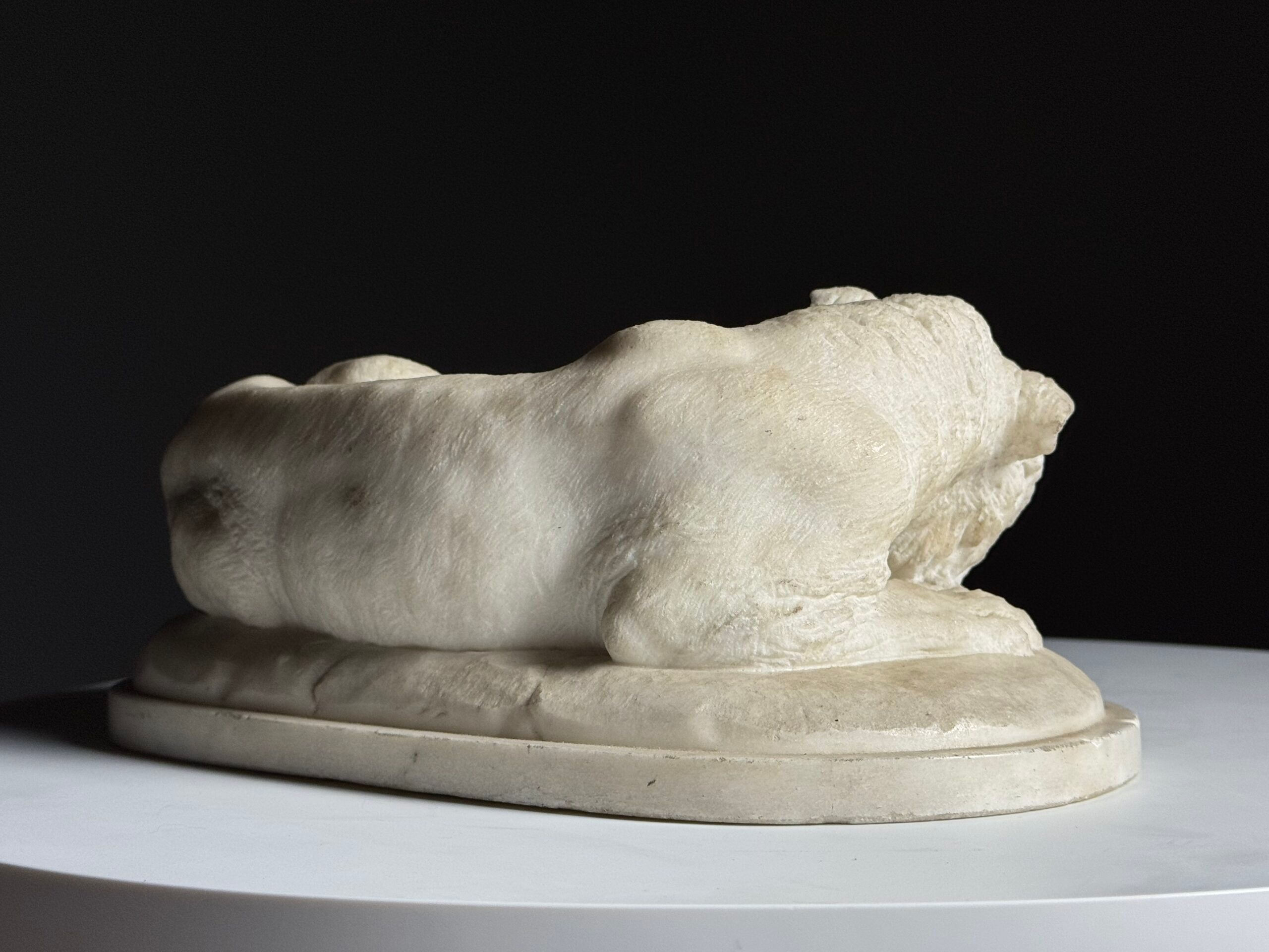 Marble sculpture of a reclining lion