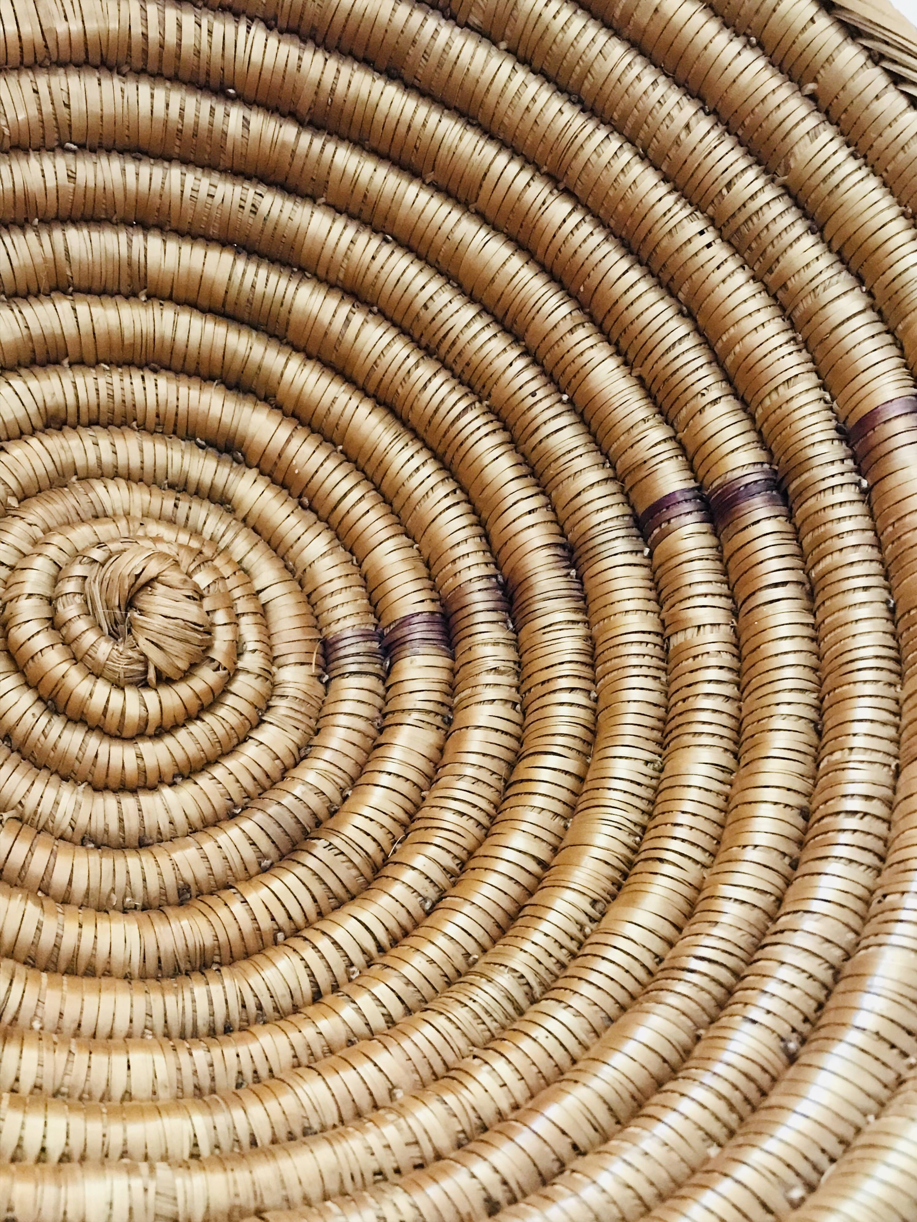 Large bowl on a woven wicker stand