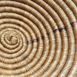 Large bowl on a woven wicker stand