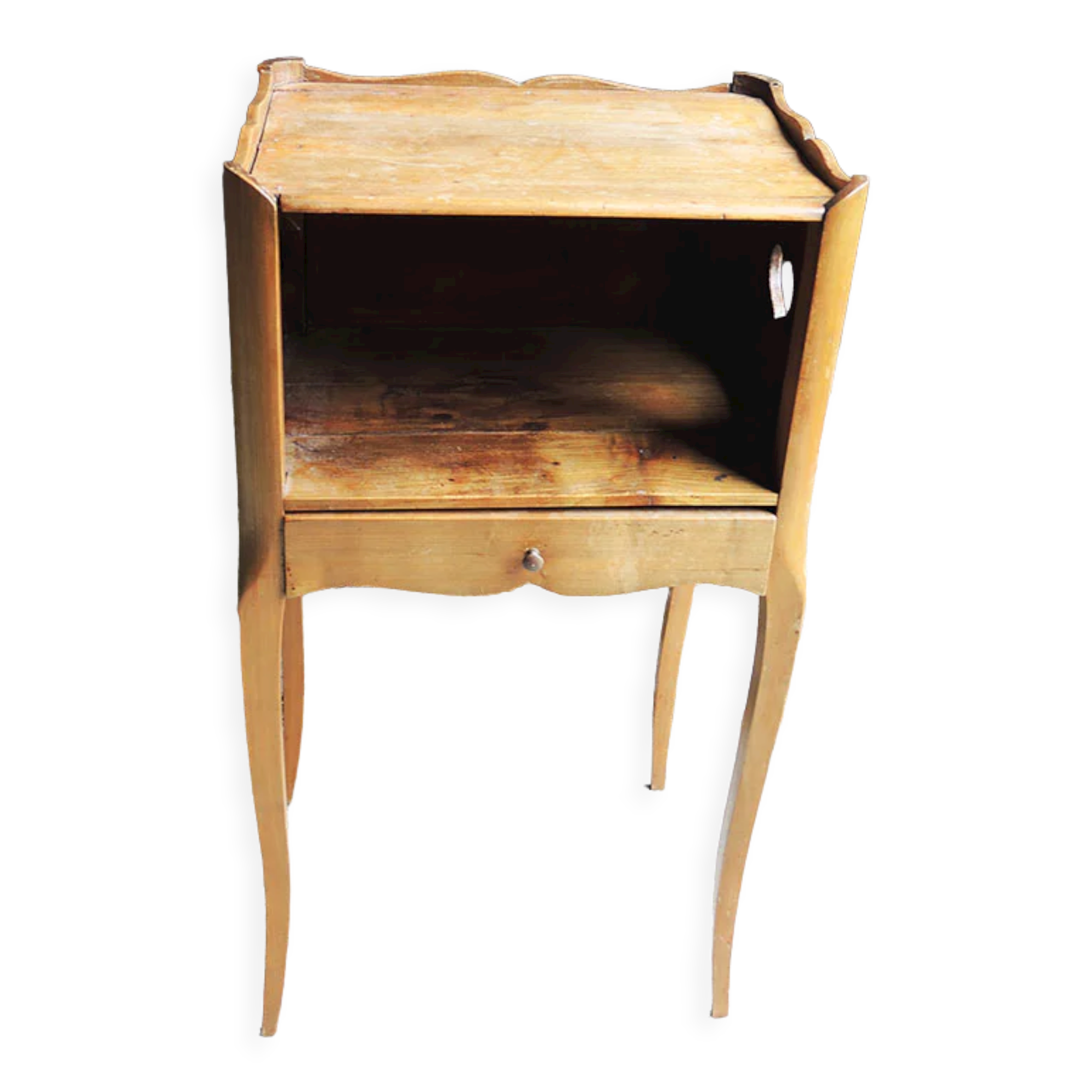 Old wooden bedside table heart pattern