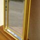 Vertical mirror, gold frame with beading.