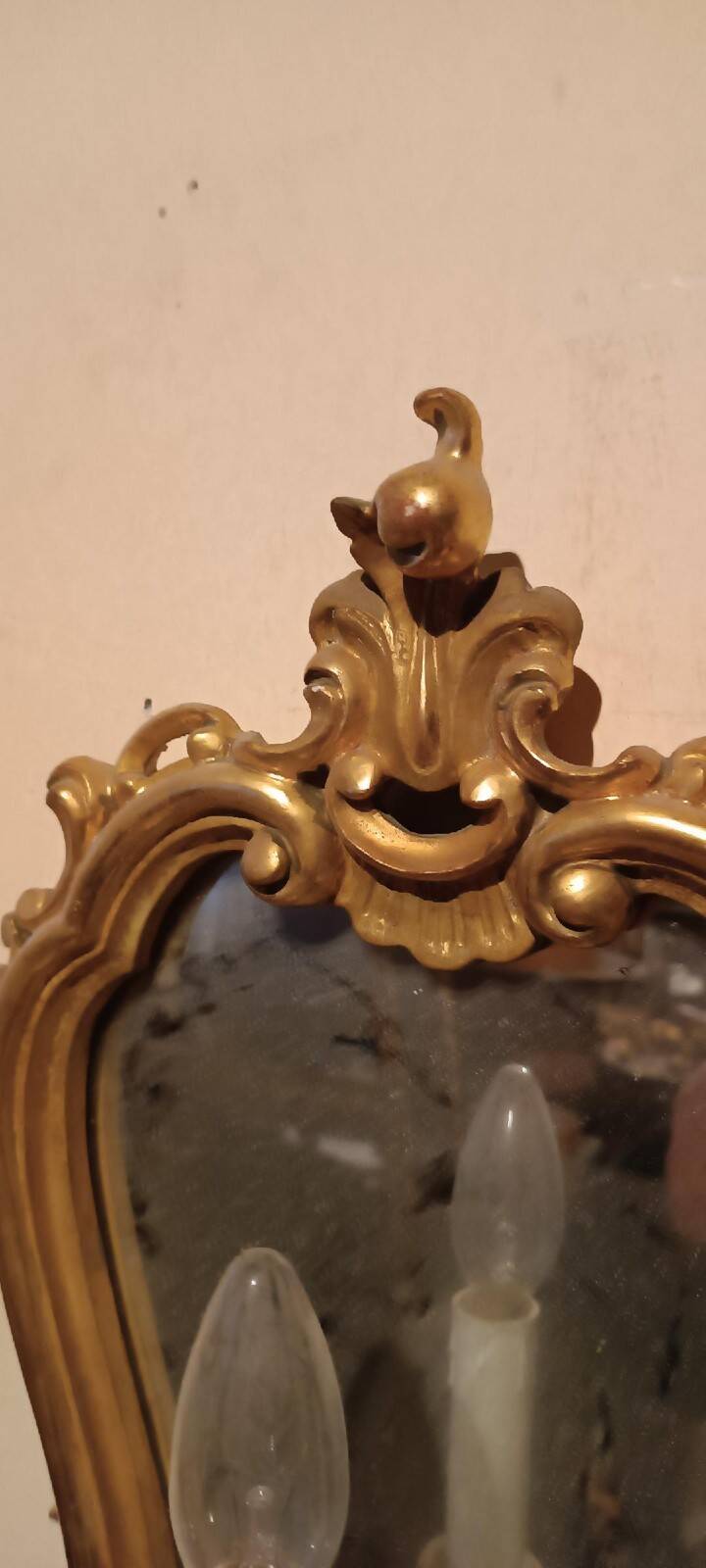Vintage gold mirror sconces from the late 1950s.