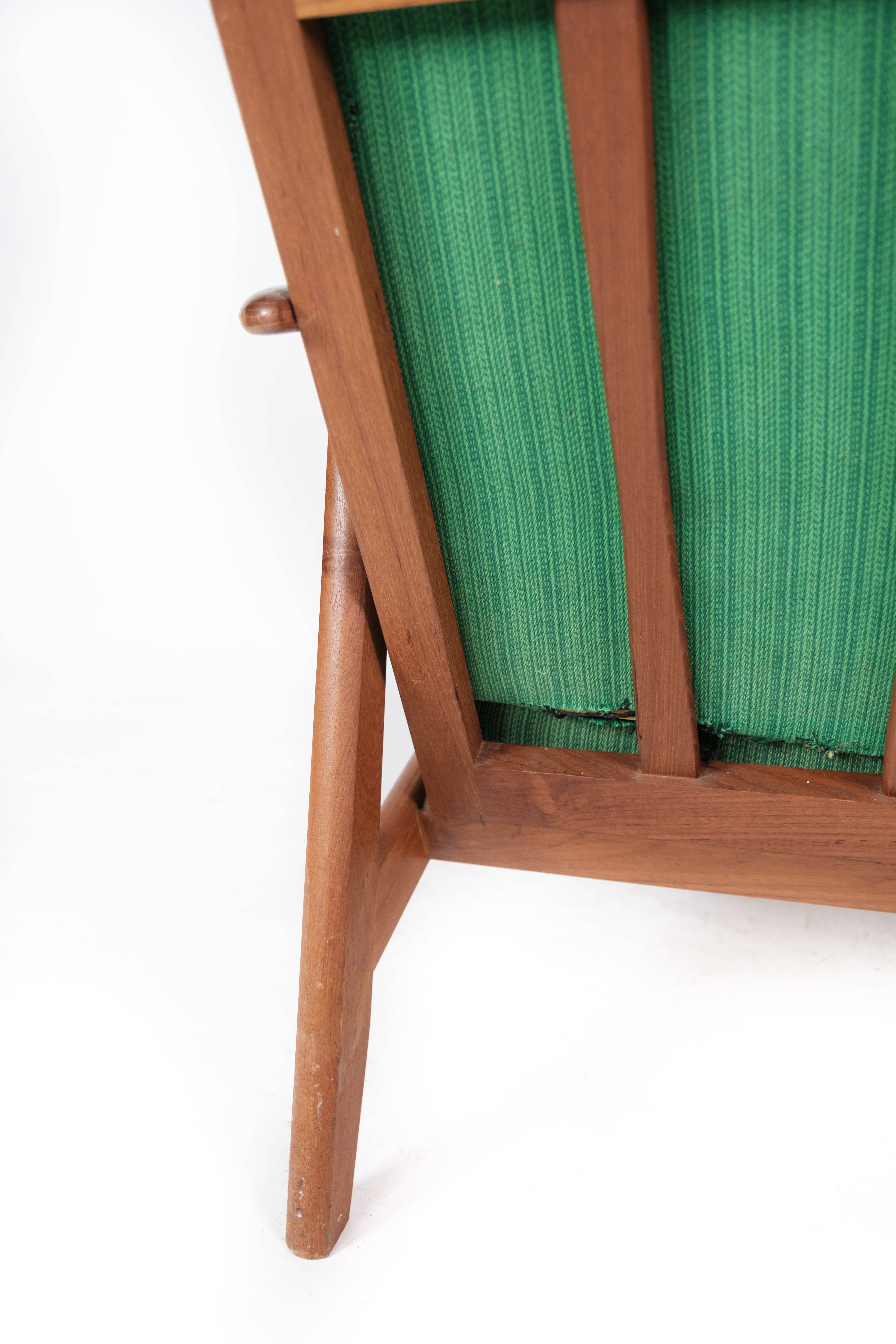 Easy chair in teak and with green upholstery of Danish design, 1960s