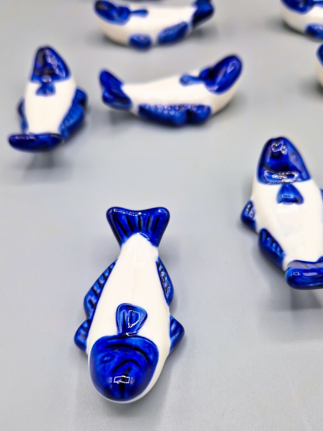Set of 11 vintage blue and white porcelain fish knife rests.