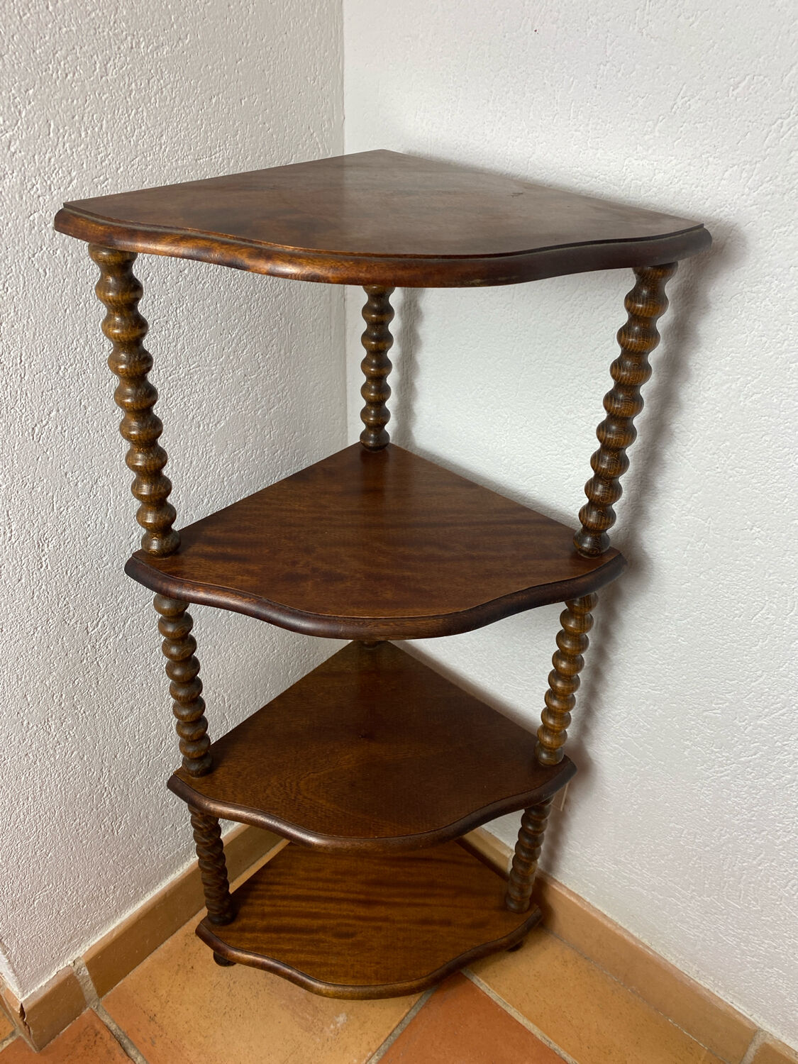 Corner shelf on a turned wooden stand