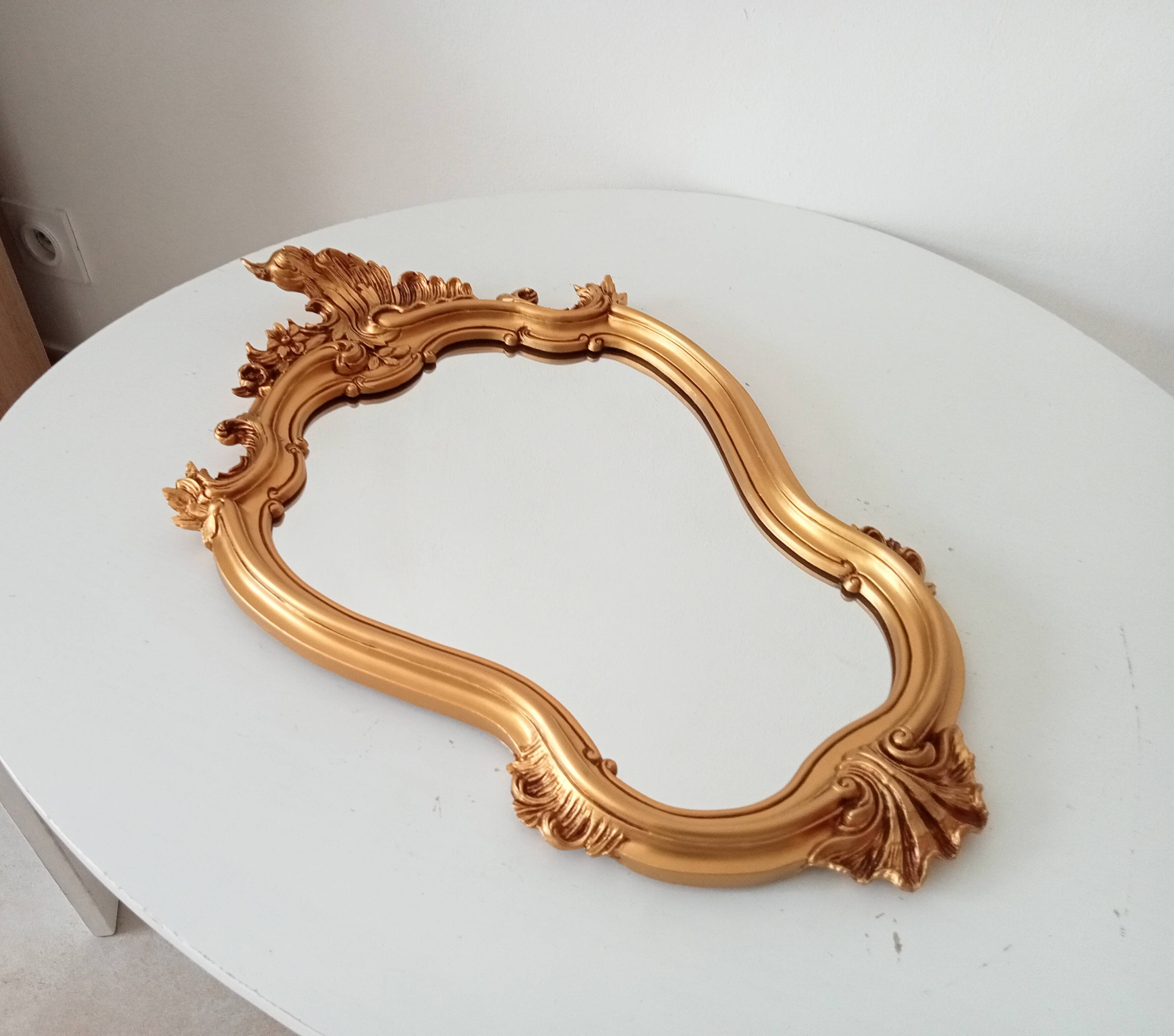 Vintage rococo mirror in gilded resin