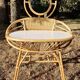 Vintage rattan hairdresser, 1960s, round mirror and woven backrest.