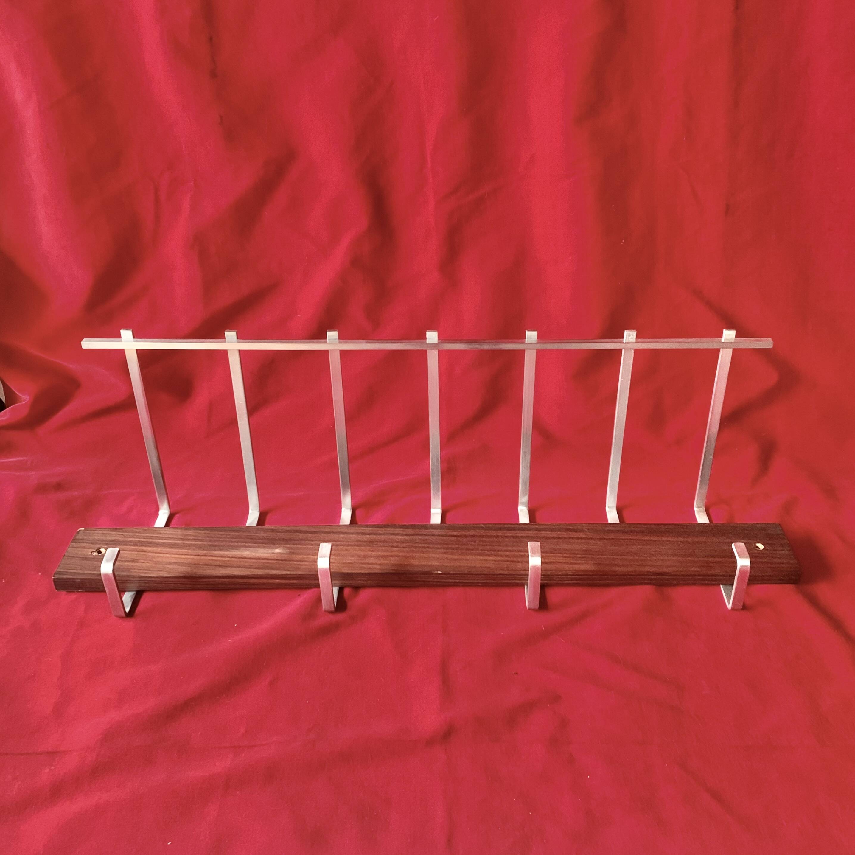 Vintage wall-mounted coat rack made of plywood and aluminum with hat rack