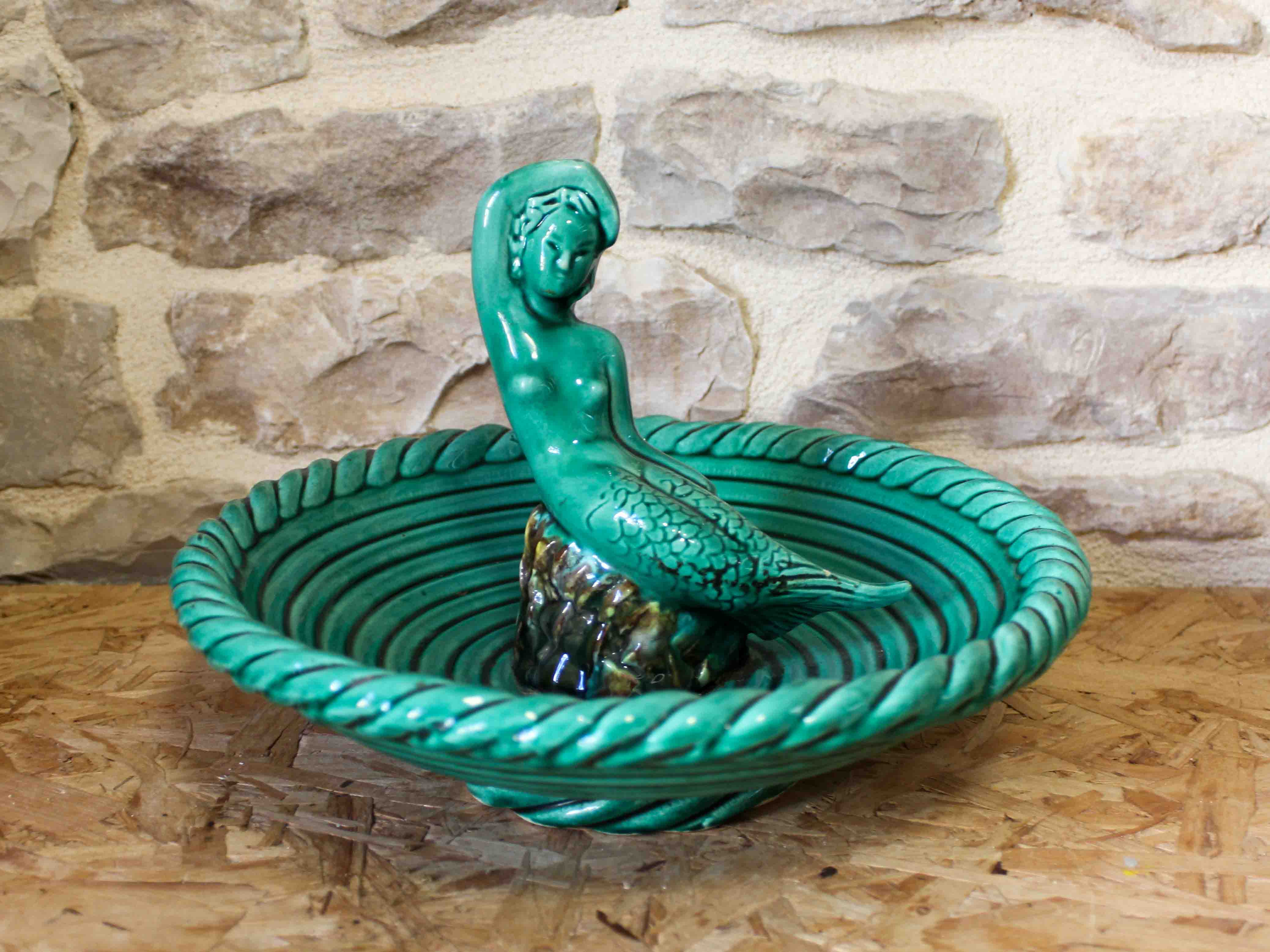 Ceramic cup with mermaid decoration