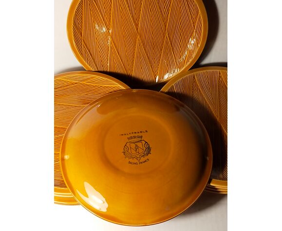 Ten plates in Salins slip with braided patterns 50s