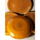 Ten plates in Salins slip with braided patterns 50s