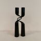 Set of two black design candlesticks, designed by mikaela dörfel for menu, denmark.