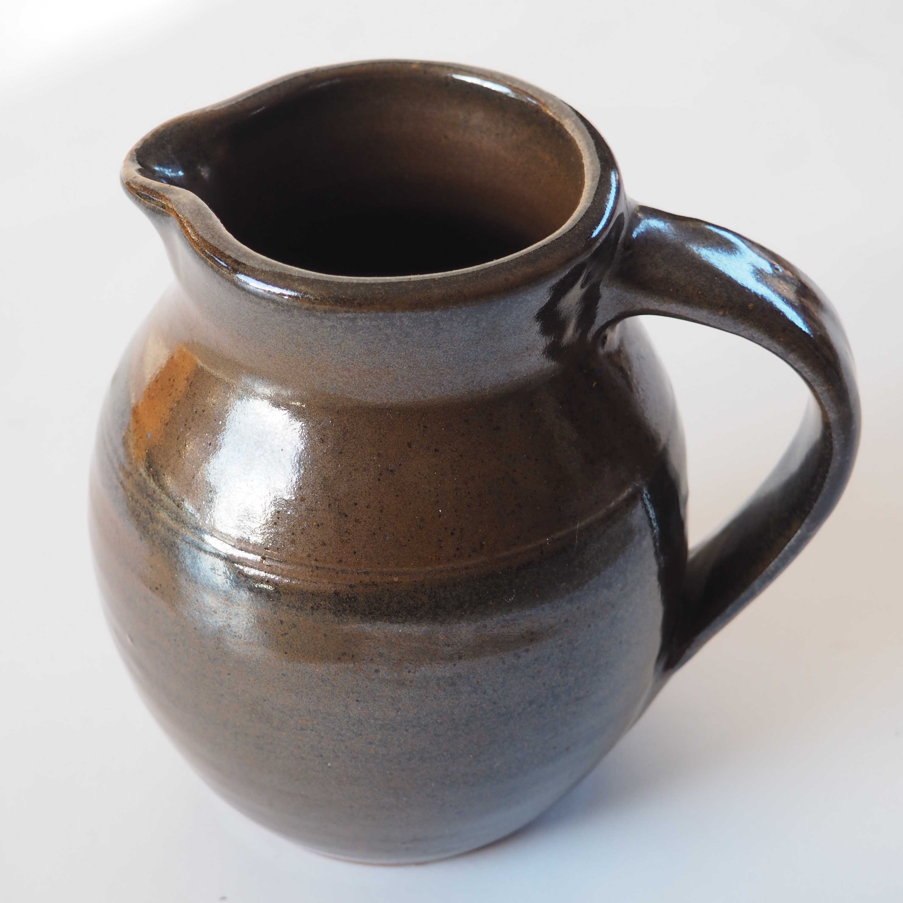 Duo of sandstone pitchers