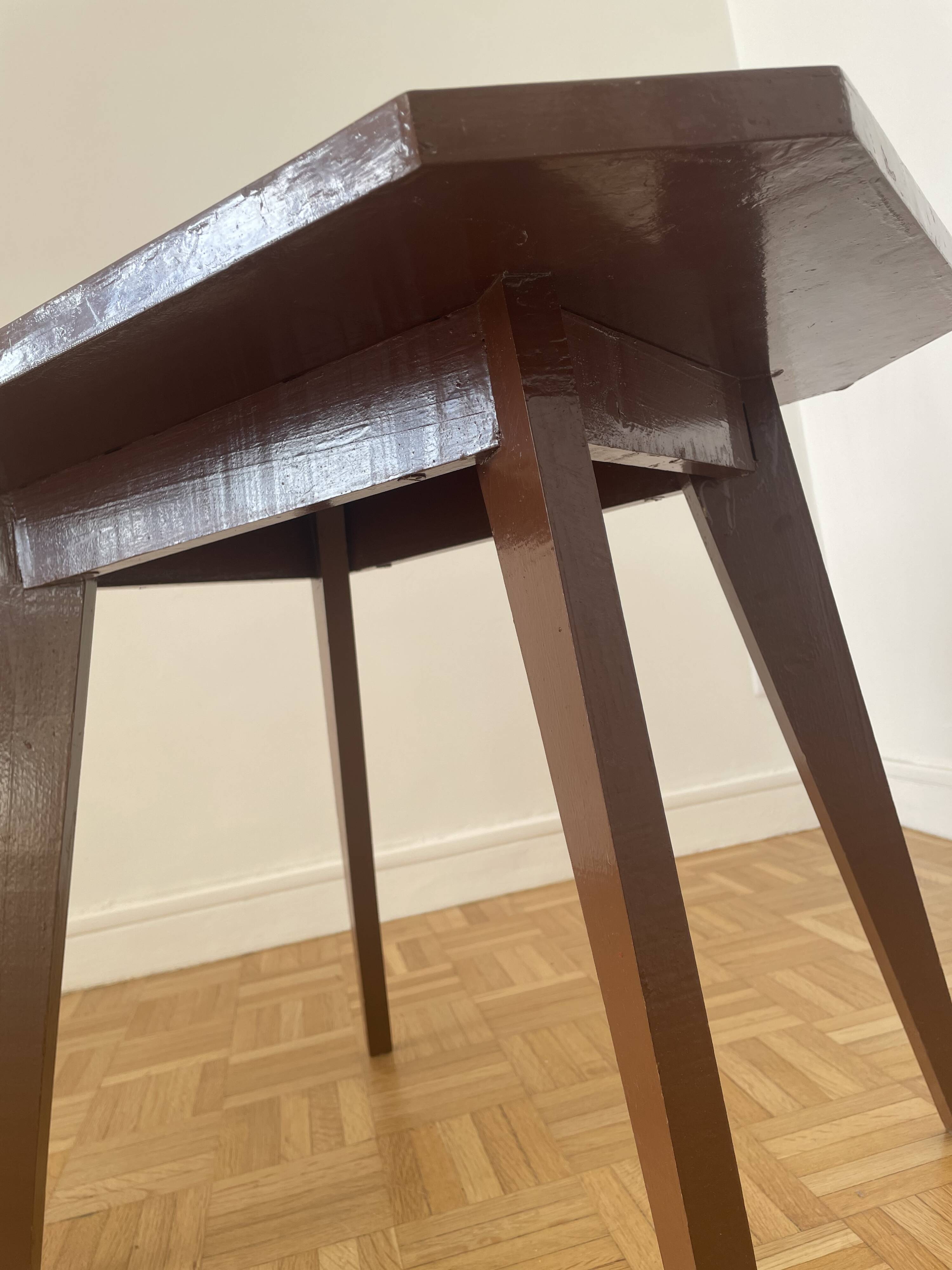 Brown coffee table with tapered legs.