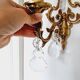 2 antique bronze and rock crystal candles and one light sconces in classic style