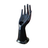 Hand holds black jewelry, ring sizer, soliflore, vintage French, 50s