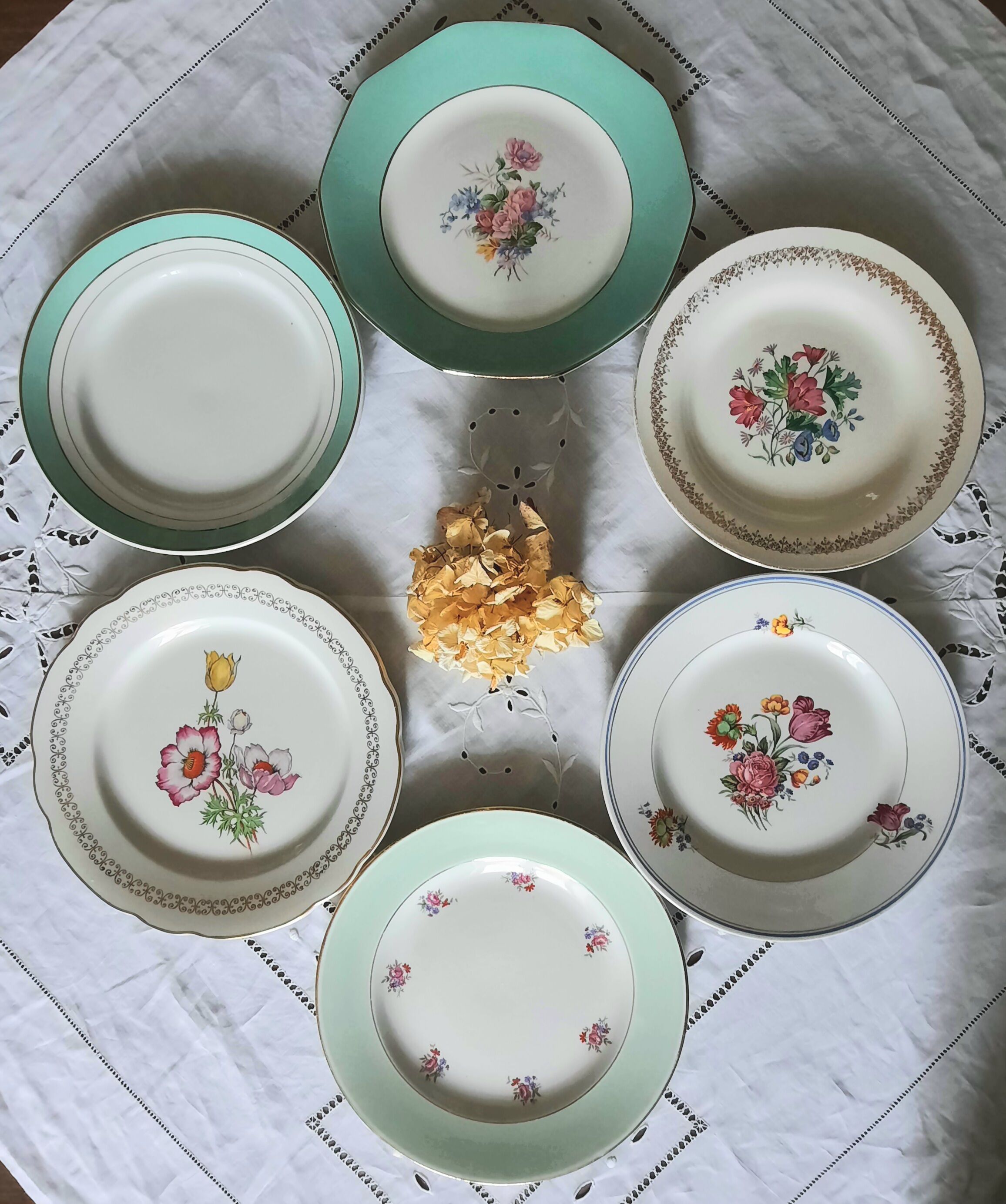 Pitted old flat earthenware plates with gold