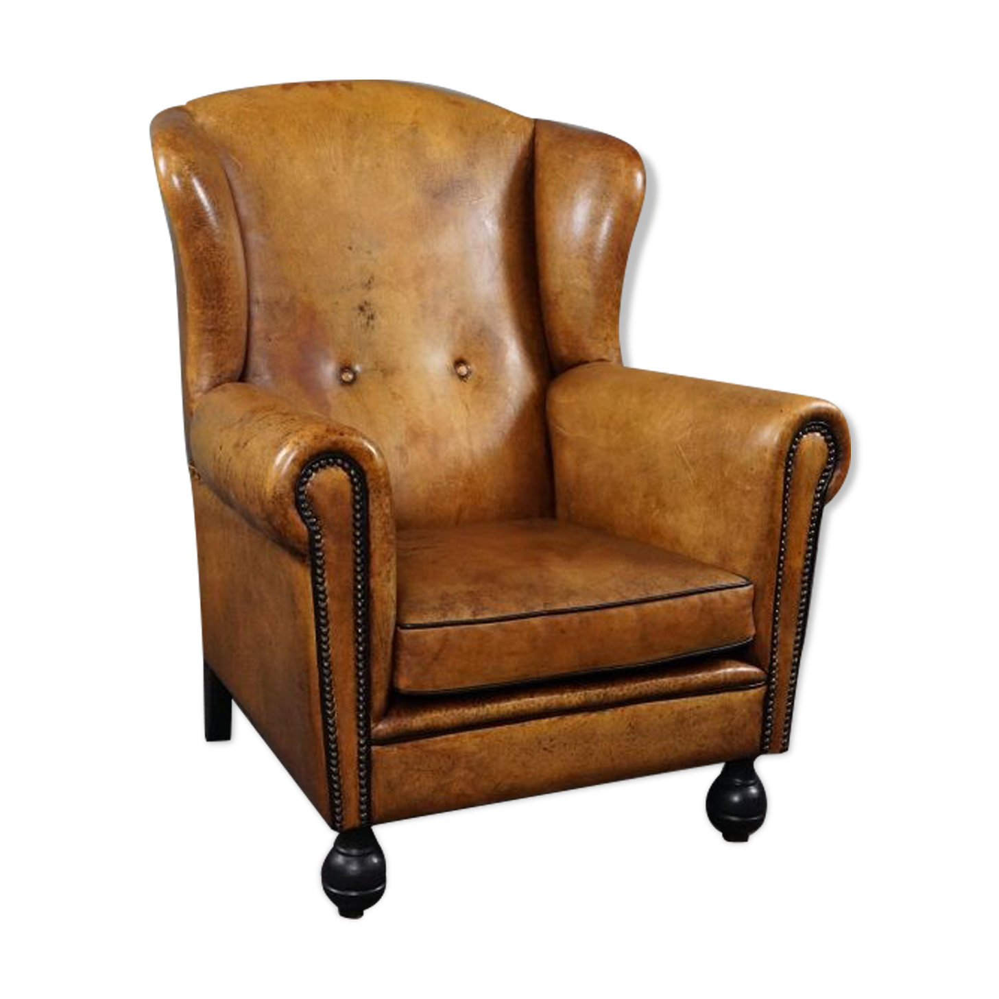 Antique armchair in patinated sheepskin