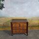 Small 18th-century chest of drawers in walnut and cherry wood.