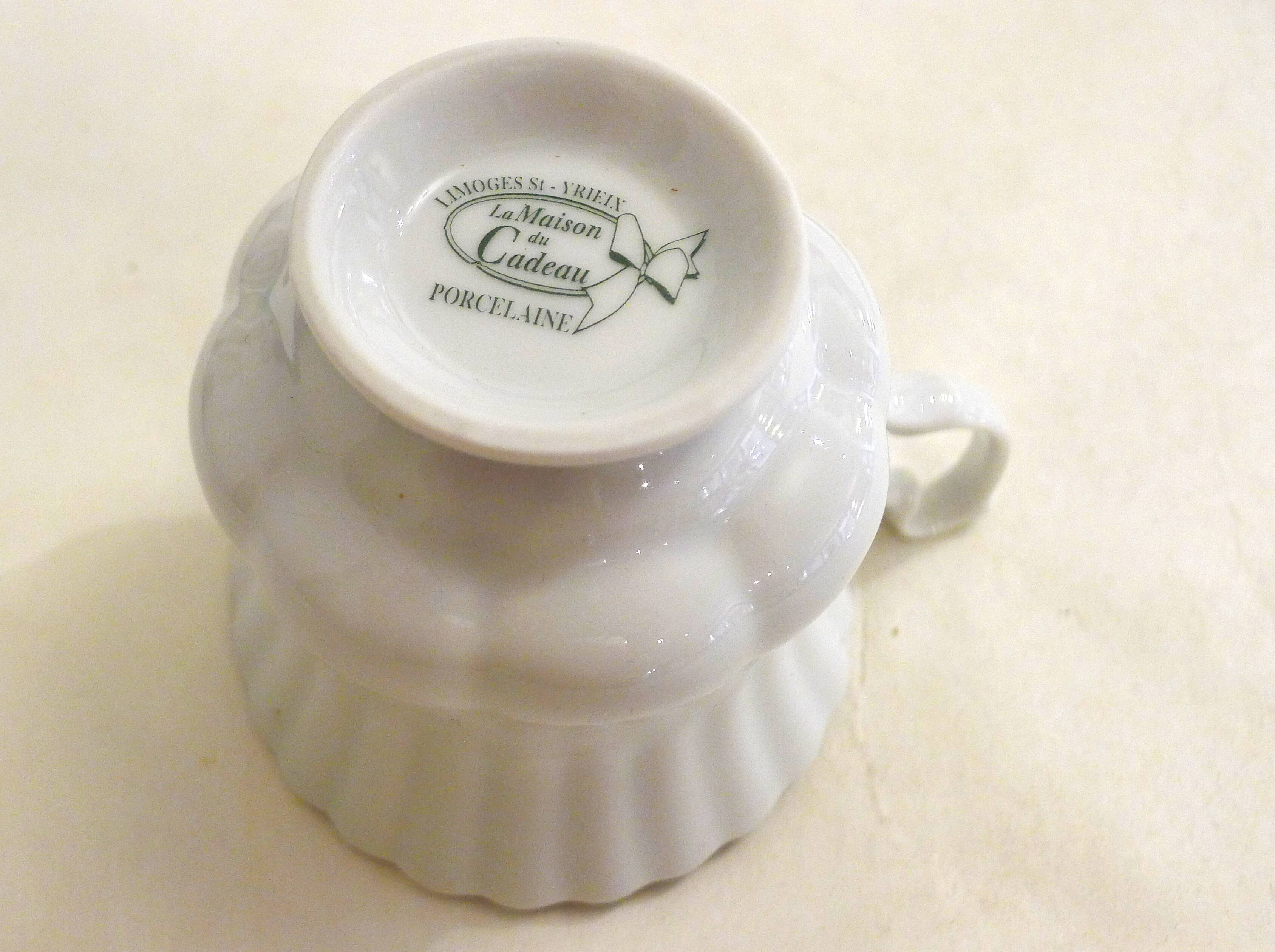 Tea cup, solitary service, naturalistic decoration, in Limoges porcelain.