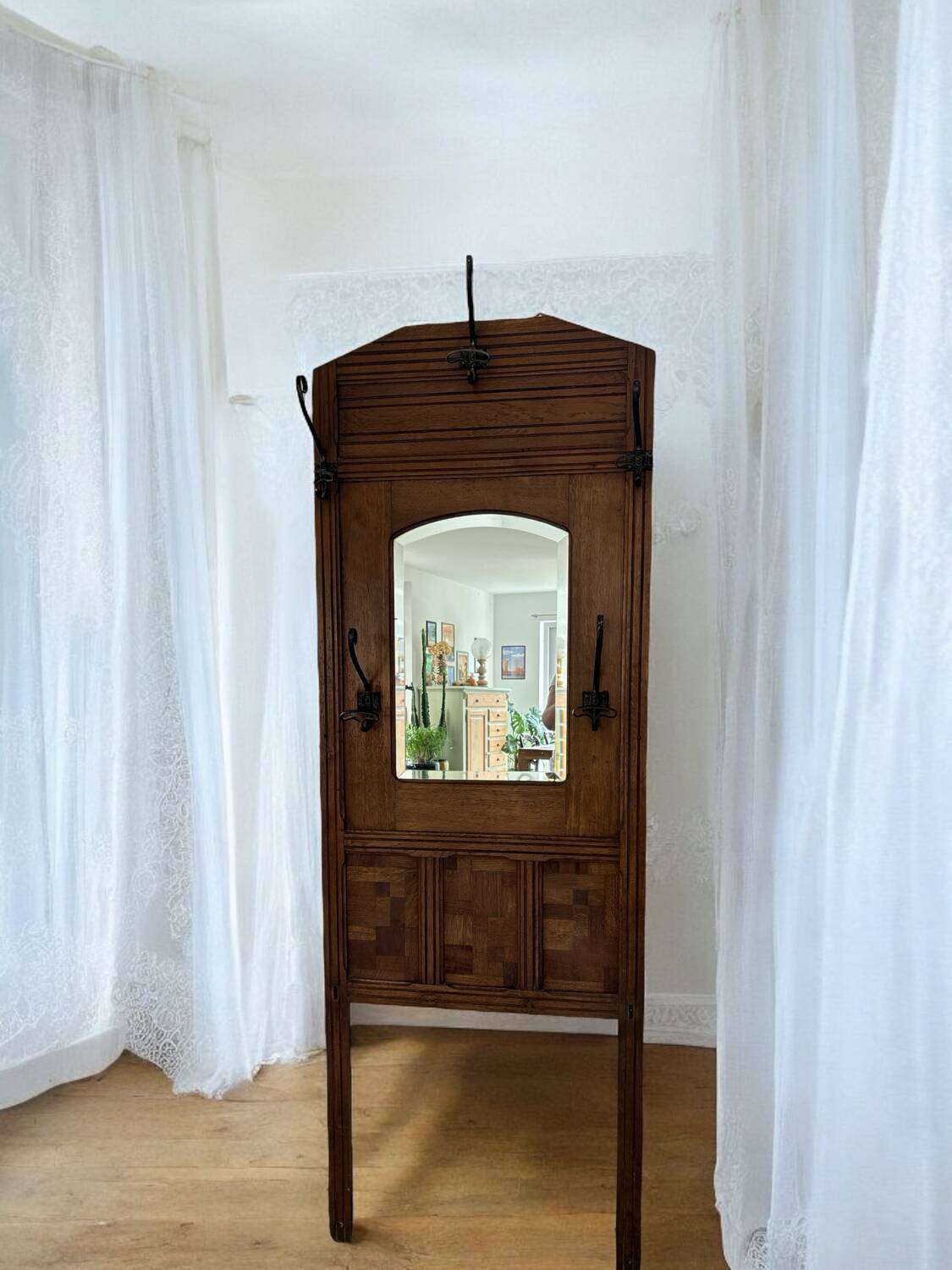 Wooden and wrought iron coat rack