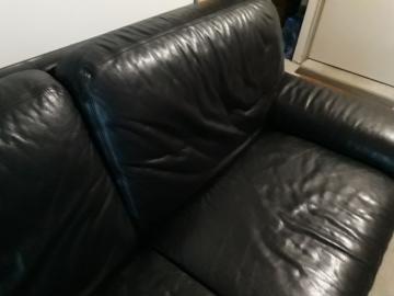 Natuzzi black leather sofa