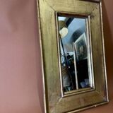 old wood mirror with gold leaf