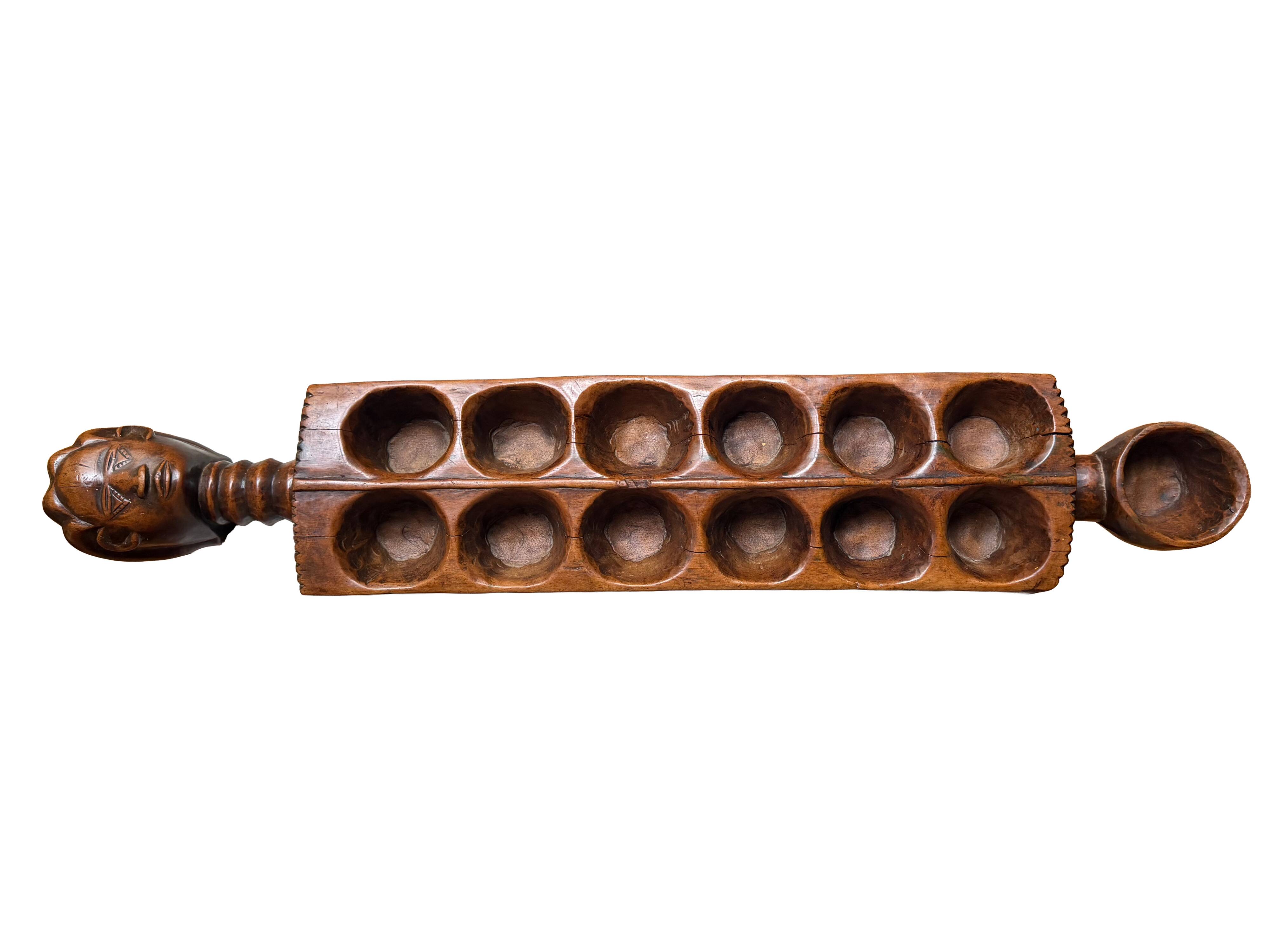 Ancient African Awalé in carved wood – traditional game – Ivory Coast