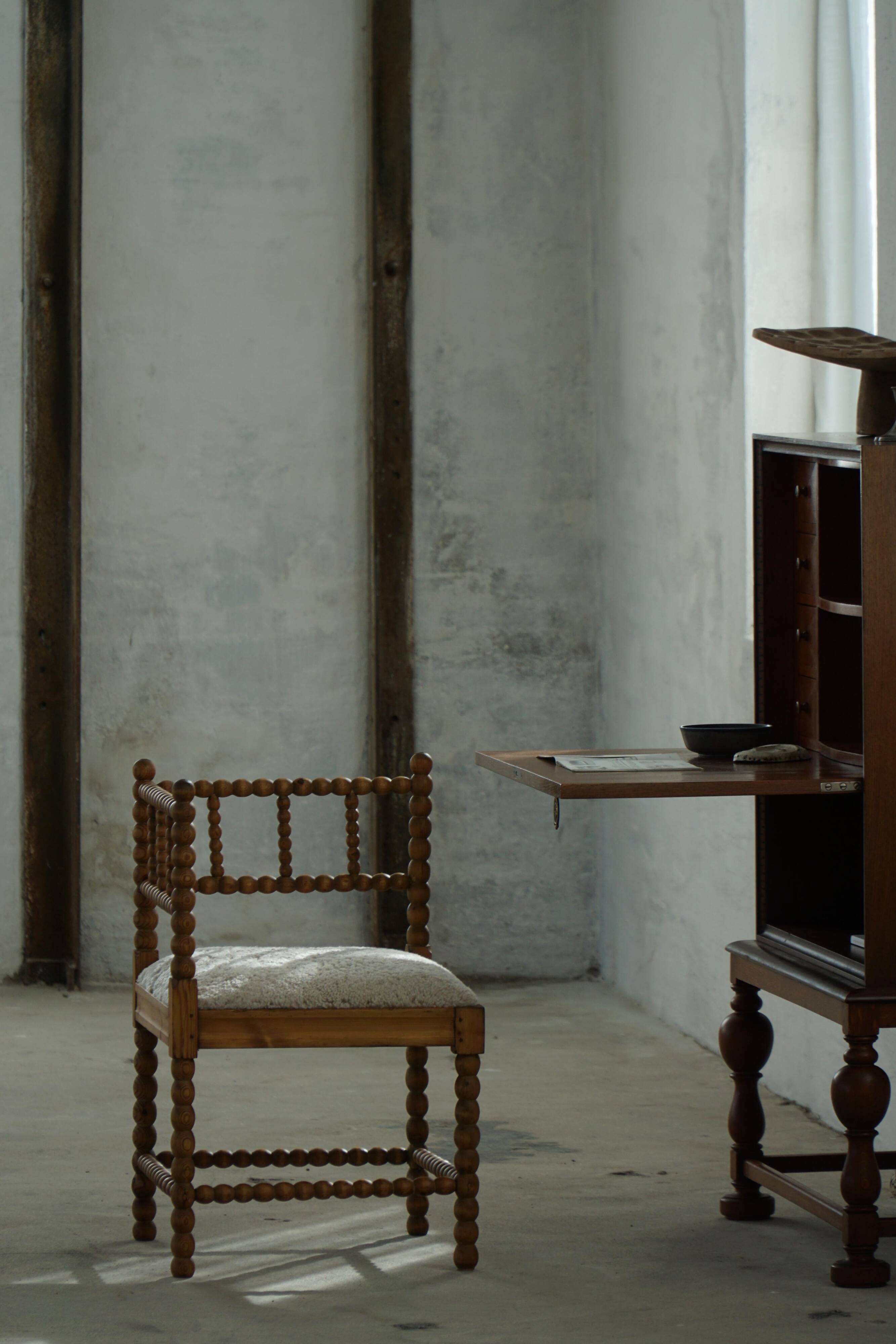 Antique French corner chair handcrafted with lamb's wool, early 20th century.