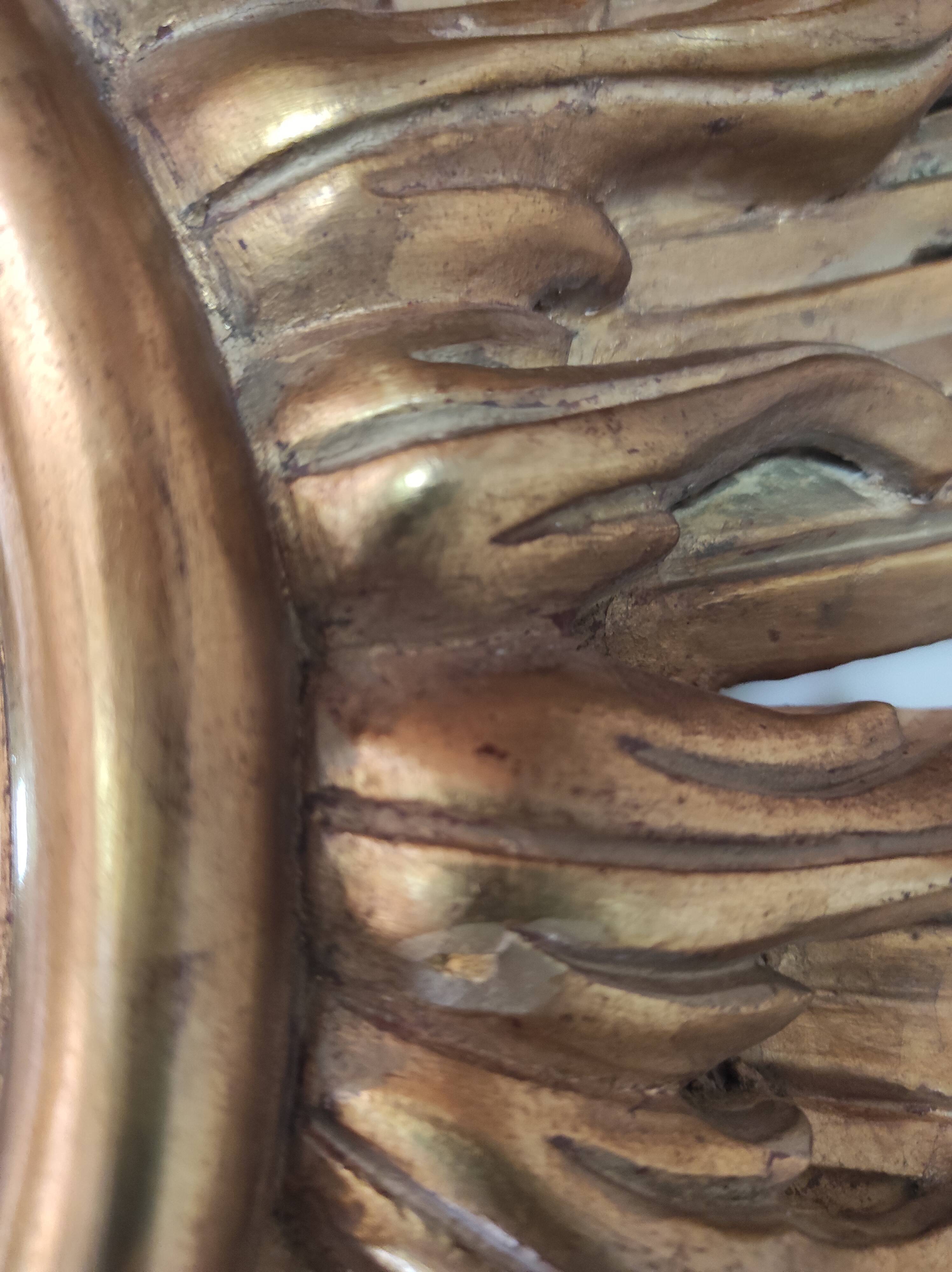 Sun mirror and witch's eye in gilded wood