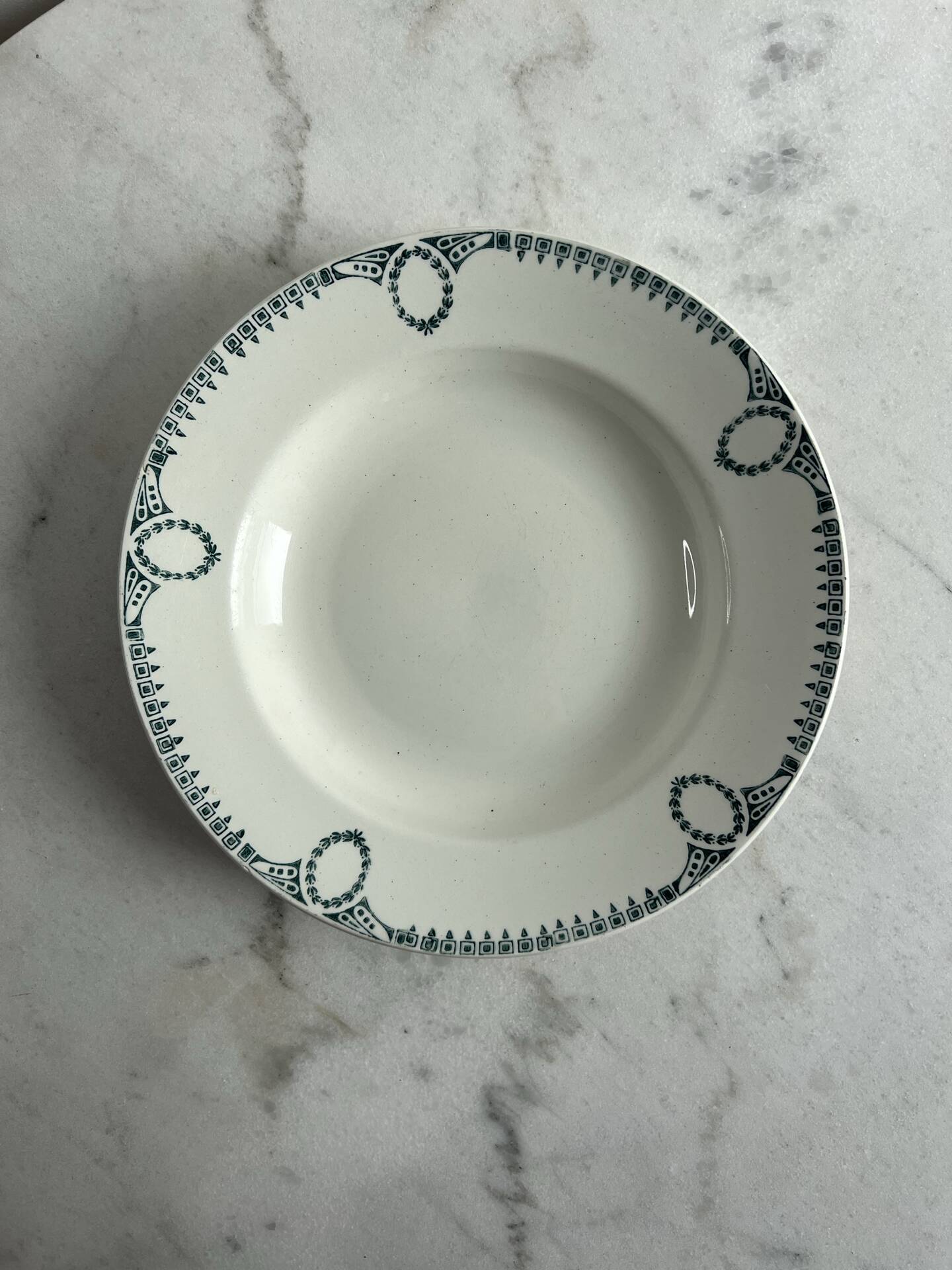 Céranord Saint Amand deep plate with green crown decoration.