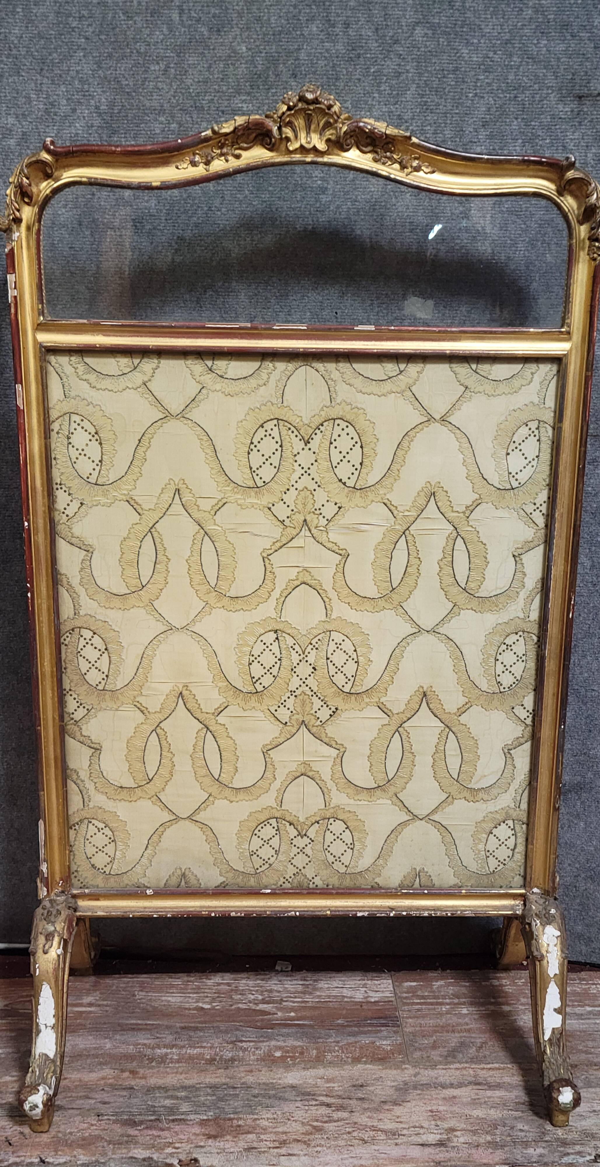Antique Louis XV style fire screen, in carved and gilded wood, in need of restoration