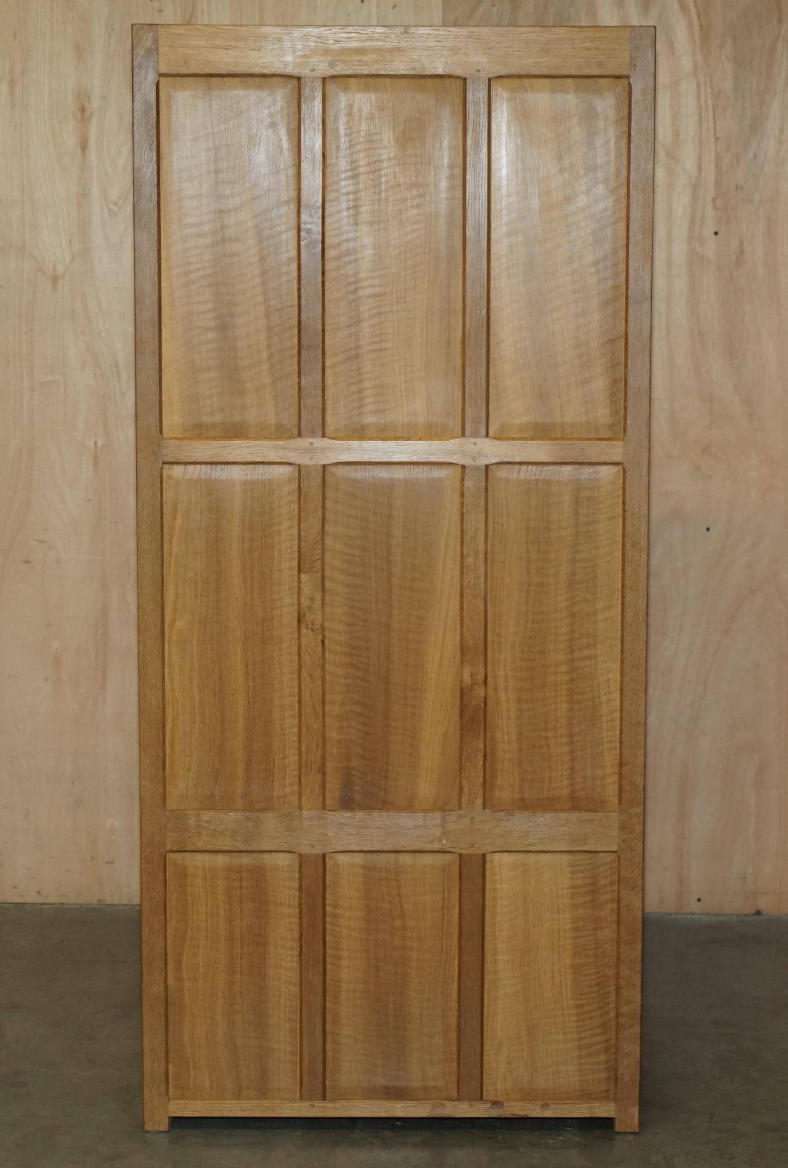 Pair of Robert Mouseman Thompson oak carved bookshelves.