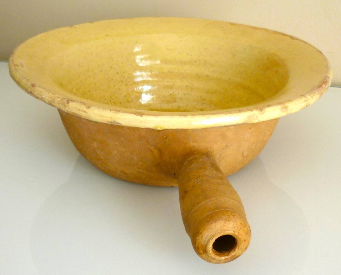 Frying pan, old caquelon, yellow glazed earthenware from the south of France.