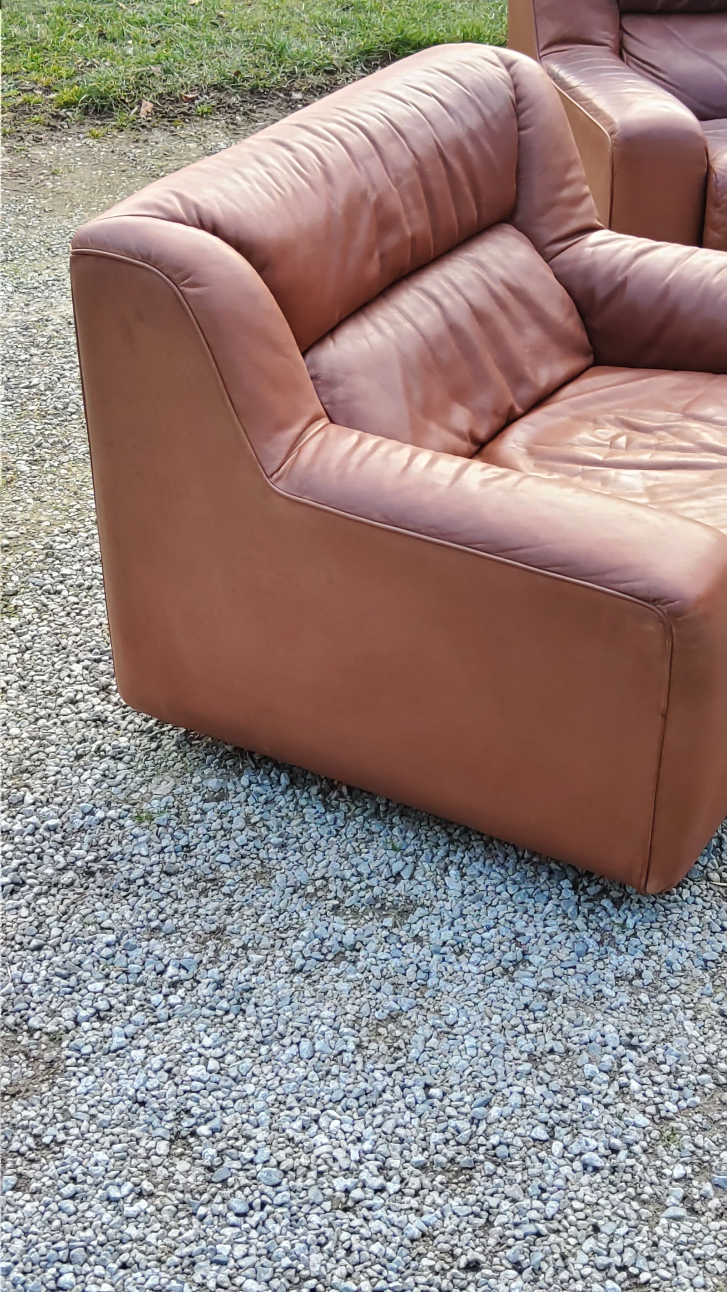 Pair of armchairs and De Sede sofa in cognac leather from the 70s/80s