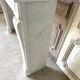 Louis XVI fireplace in white marble, 19th century.