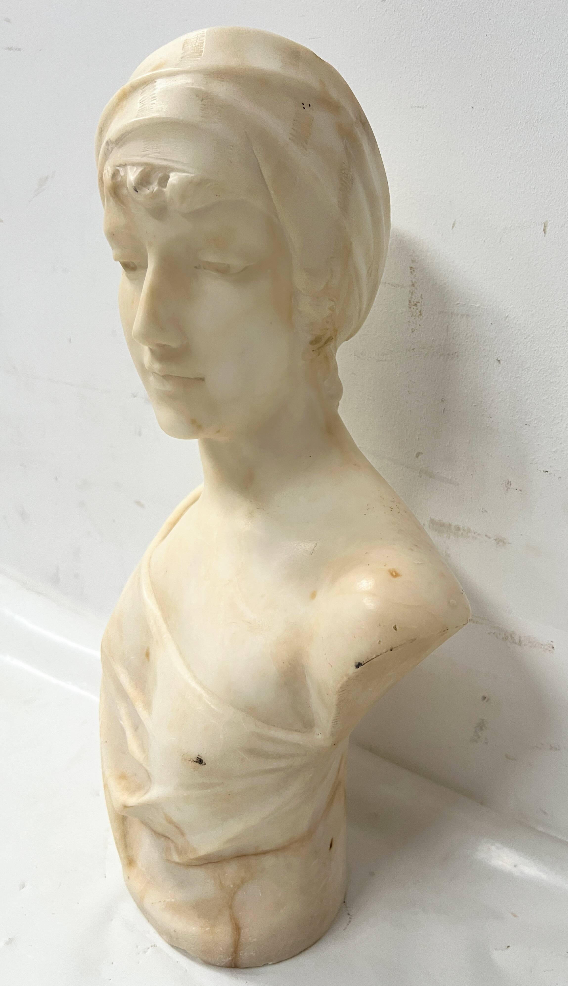 Sculpted marble group of a young woman's bust, 20th century.