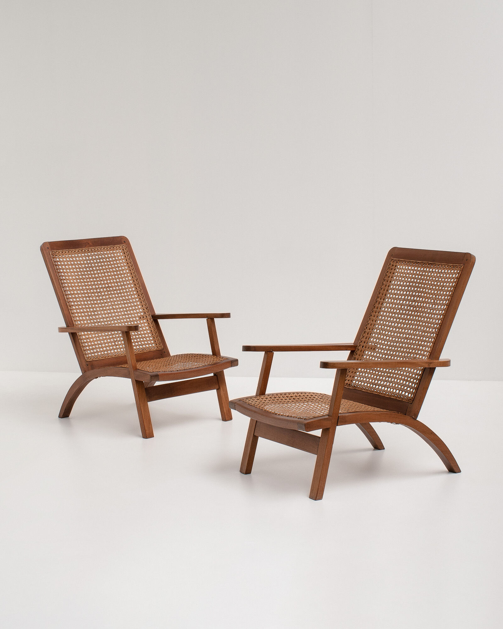 pair of french mahogany and cane armchairs, 1950s