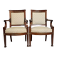 Pair of Empire period armchairs, in mahogany and gilded bronze.
