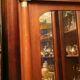 Mahogany pediment and half-column mirror and 118x91cm Empire-style bronze ornament