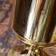 Set of candlesticks and tubular vases in solid brass.