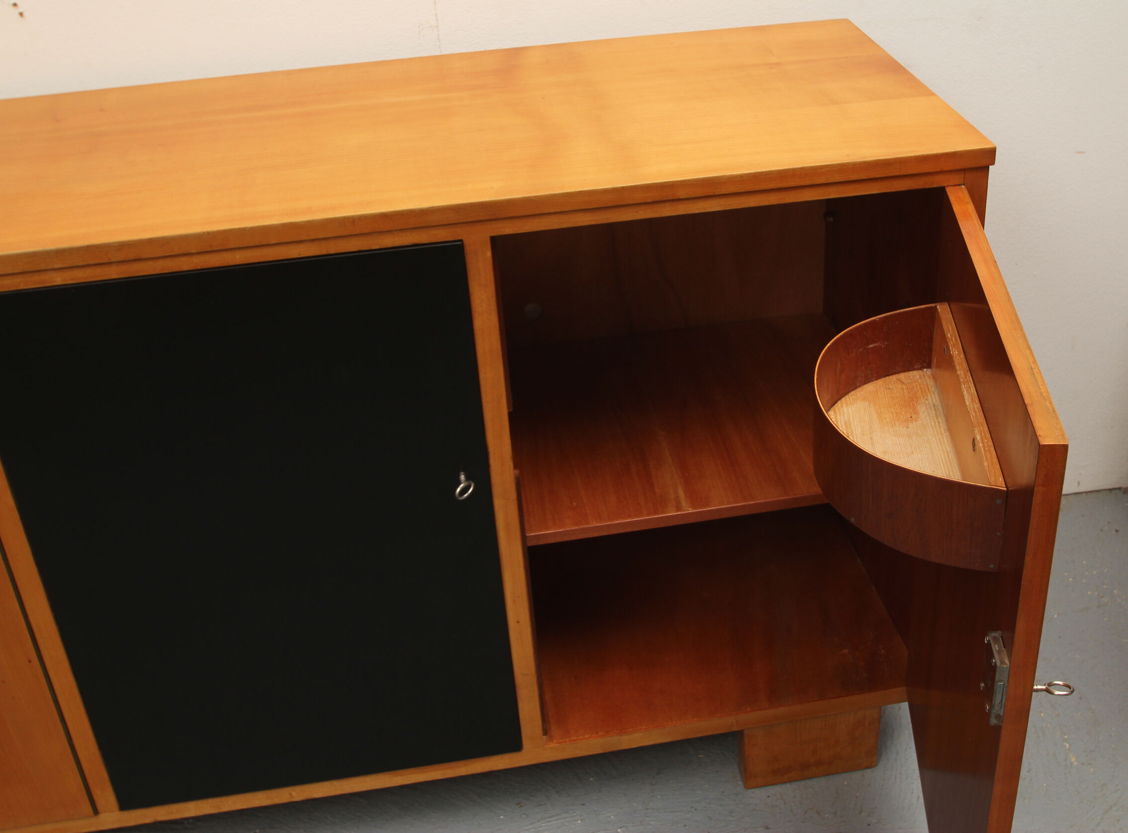 Sideboard in cherrywood with black and white doors 1950s