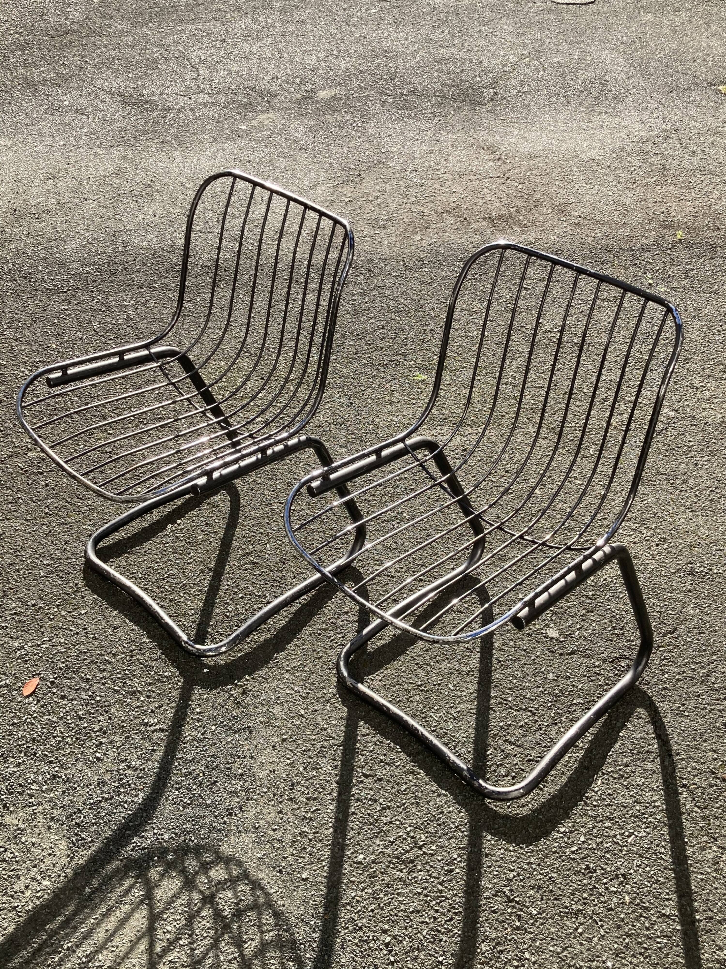 Two chairs in chrome metal