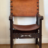 Frailero armchair, antique Spanish — carved wood & full-grain leather.