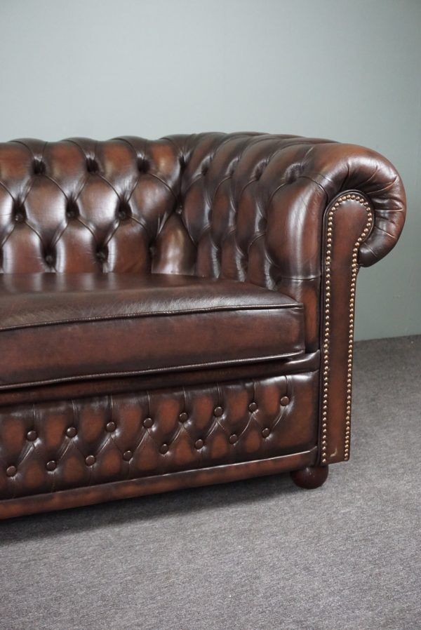 Chesterfield sofa in cowhide, 4 seats