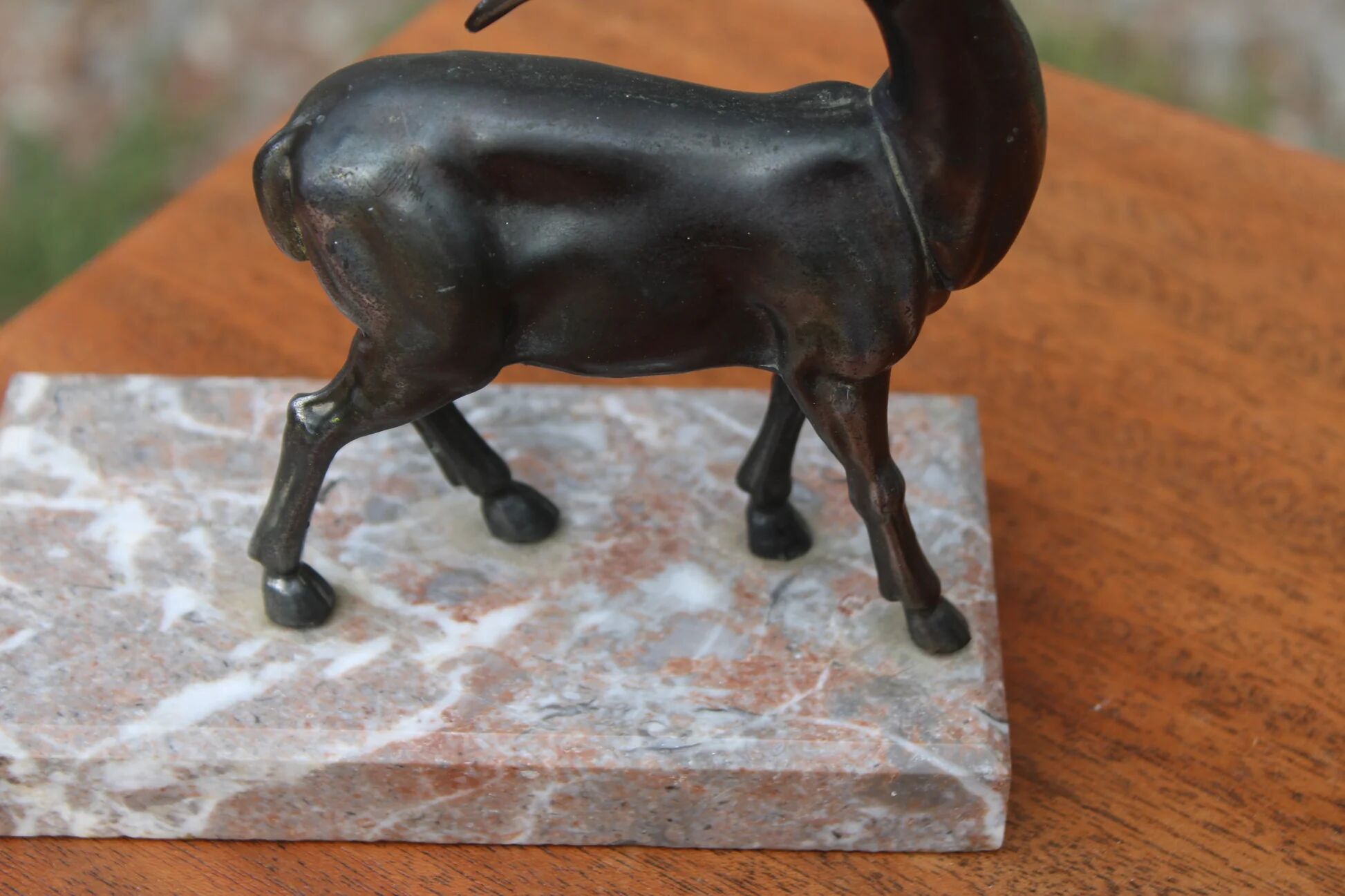 Vintage antelope gazelle bookend in patinated metal on a marble base.