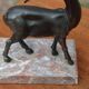 Vintage antelope gazelle bookend in patinated metal on a marble base.